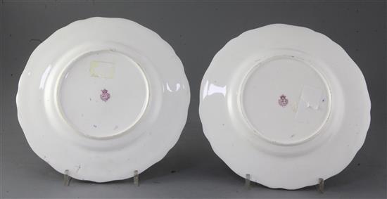 A pair of Royal Worcester cabinet plates, decorated by James Stinton, diameter 9.25in.